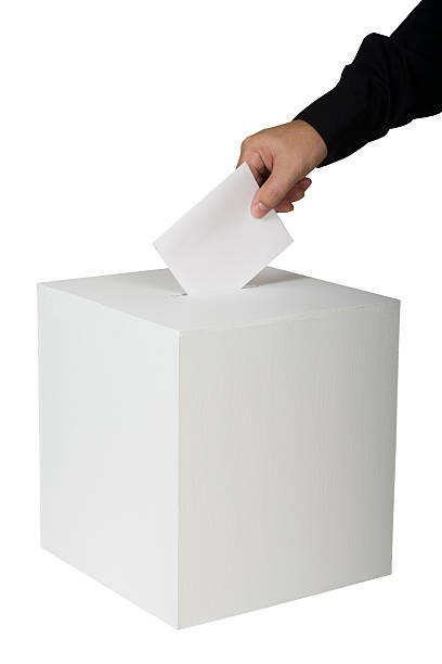 istock A person putting a vote in a ballot box 185408914