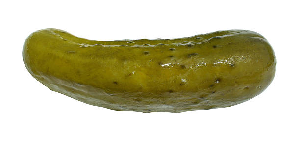 Large, green, dill pickle on a white backdrop stock photo