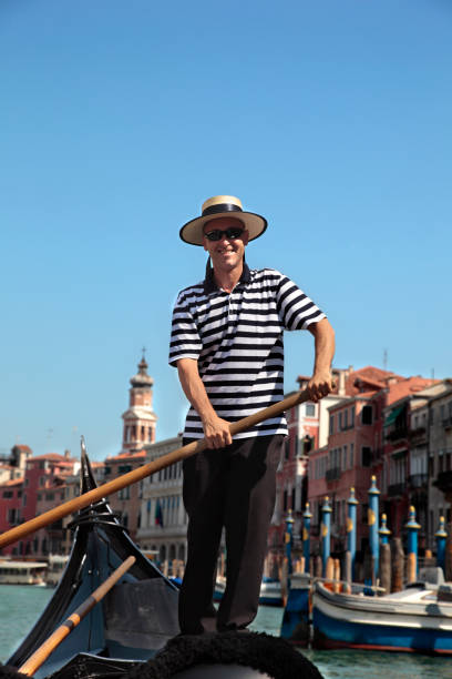 gondoliere in venedig - men gondolier people activity stock-fotos und bilder