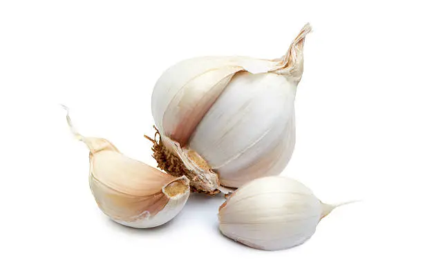 Photo of Close-up of garlic clove on white background