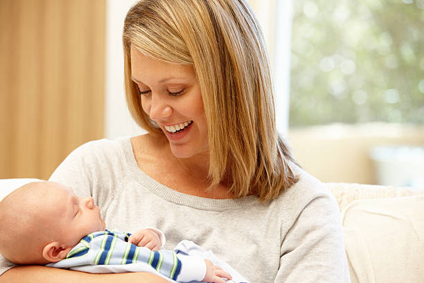 istock Mother at home with new baby 185408975