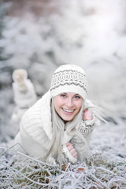 Portrait close up of beautiful young blonde woman outdoors