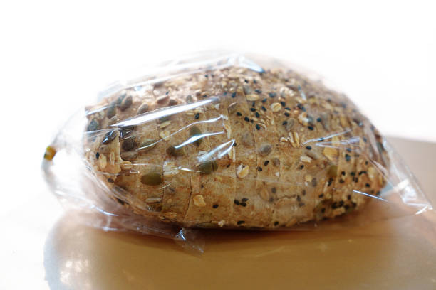 Close-up of sliced sourdough bread in a plastic bag.