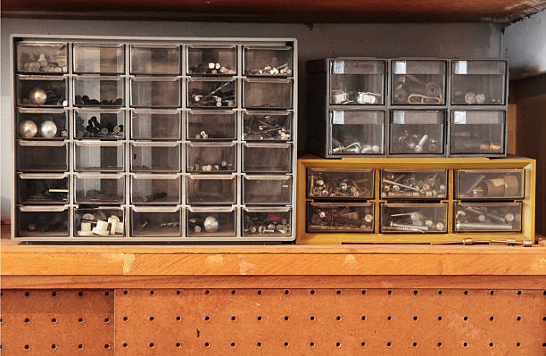 Workbench drawers with screws "An organized workbench shelf: nuts, bolts and screws organized into small plastic drawers." bolt fastener photos stock pictures, royalty-free photos & images