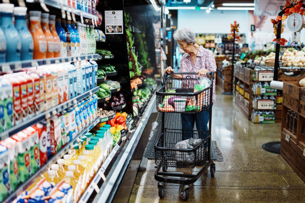 istock Elderly woman grocery shops for a plant based diet 1854095359