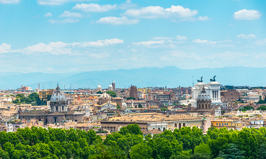 Italy, Milan - August 30, 2022: Famous buildings of Italy. Action. Beautiful monuments on architectural palace of Italy. Cultural attractions and sculptures on buildings of ancient historical city. Monuments and Vittoriano Palace in Rome.