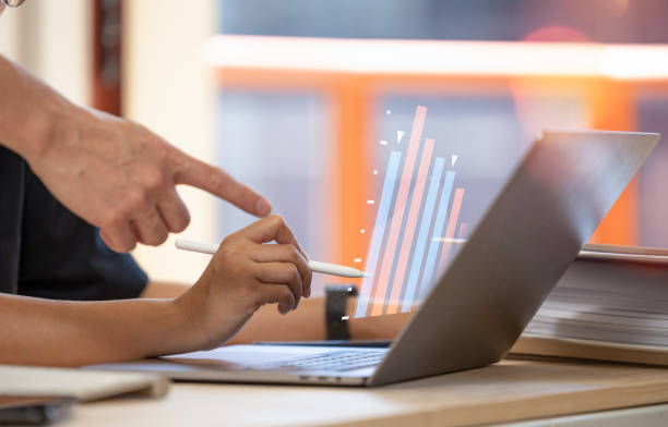 business adviser meeting to analyze and discuss the situation on the financial,Investment Consultant,Financial Consultant,Financial advisor and accounting concept stock photo