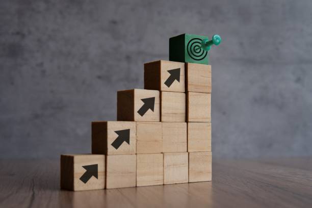 Wooden blocks with arrow and target board.