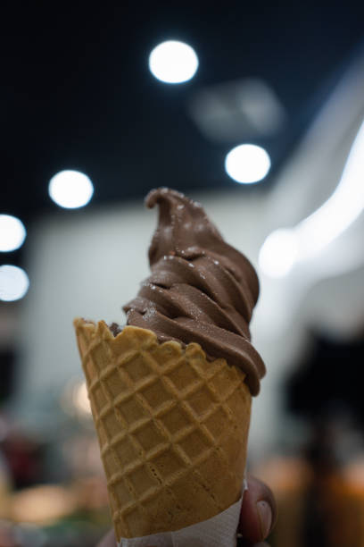 istock Chocolate soft serve ice cream cone or frozen yogurt 1854163288