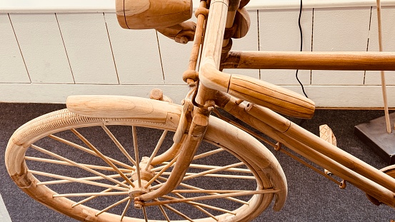 Wooden bicycle detail, front wheel ,from above