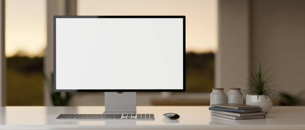 istock Front view of a modern workspace in a modern office room with a PC desktop computer mockup on a desk 1854217106