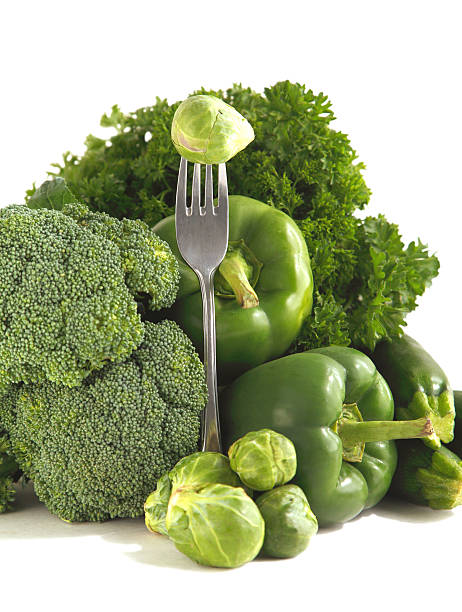 Fresh green vegetables on a white background.