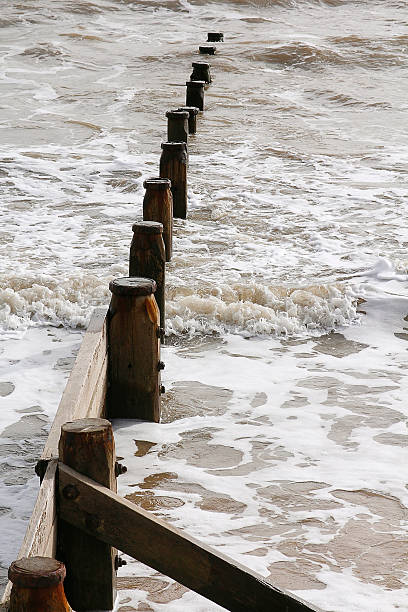 istock Groynes break the sea 185423660