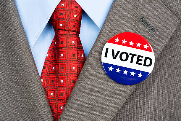 istock Vote badge on tan suit 185423662