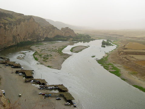 the landscape near Jeti Oguz gorge with yurts and green meadows on a cloudy day