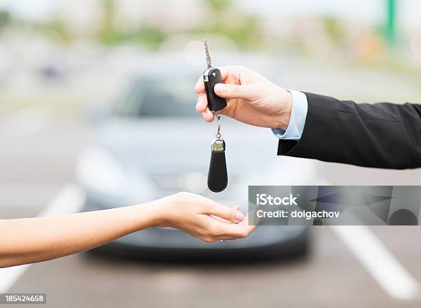 Customer And Salesman Hands With Car Key Stock Photo - Download Image Now - Adult, Buying, Car