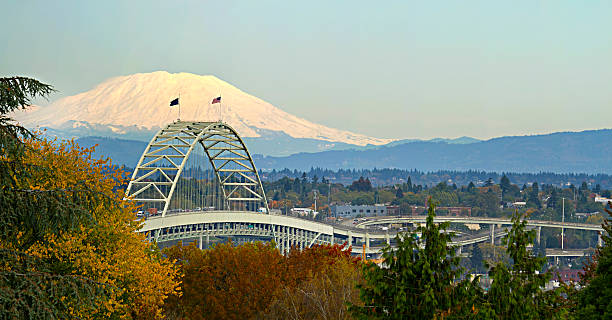 Fremont Bridge Portland Oregon Panorama Fremont Bridge Portland Oregon  and Mount Saint Helens in the Fall Panorama mount st helens stock pictures, royalty-free photos & images