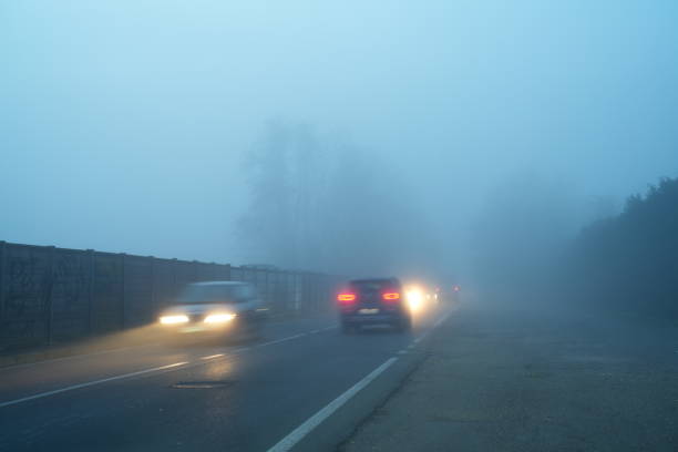 istock traffic with fog 1854255325