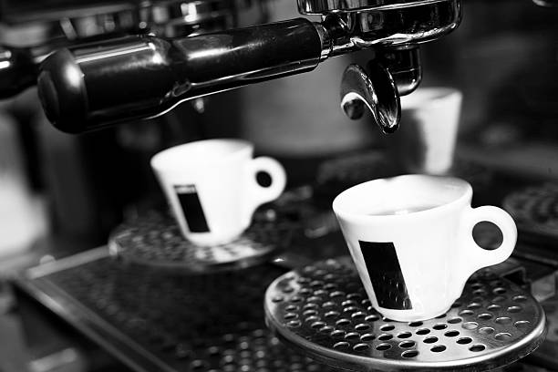 istock hot espresso in cup on coffee machine 185427536
