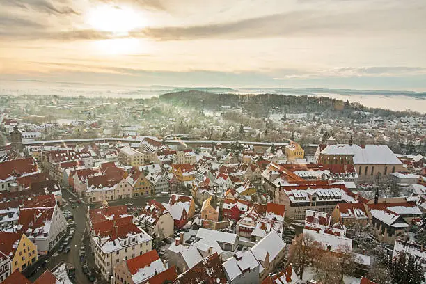 Winter panorama of medieval town within fortified wall. Top view from 90 m steeple called "Daniel" tower. Nordlingen, Bavaria, Germany