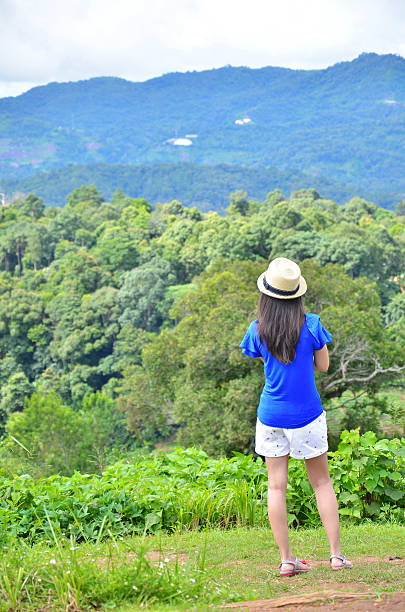 istock Woman is standing on the mountain 185428845