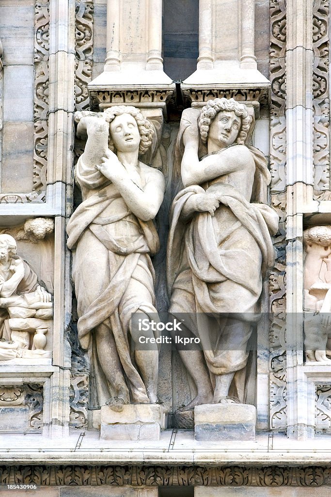 statue of a women in the front italy statue of a women in the front of the duomo  church in milan and incision Milan Stock Photo