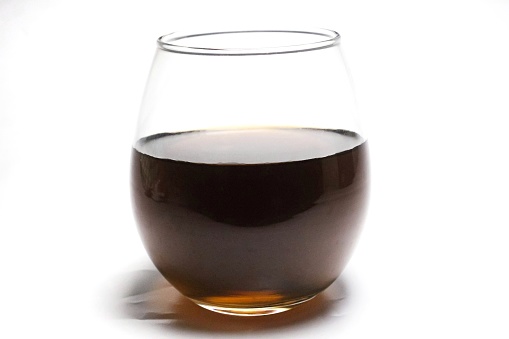 a glass of black coffee, isolated on a white background