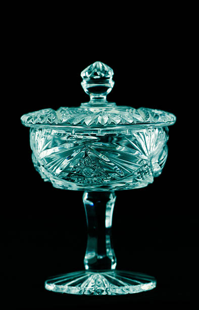 Antique bright crystal holder with lid Antique bright crystal holder with lid isolated on black background crystal chalice stock pictures, royalty-free photos & images