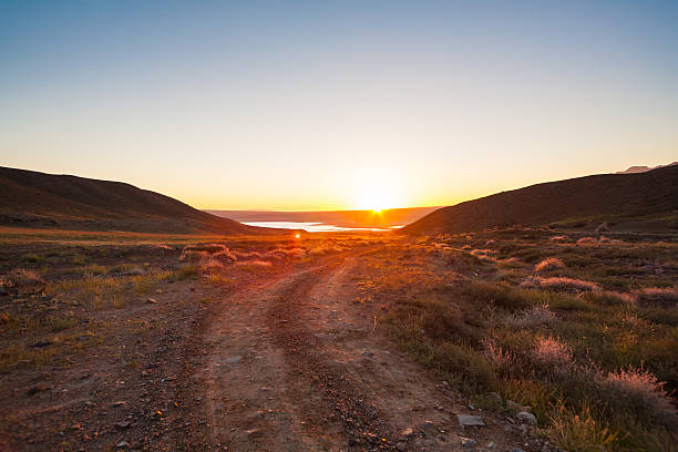 istock sunrise over the steppe lake 185431694