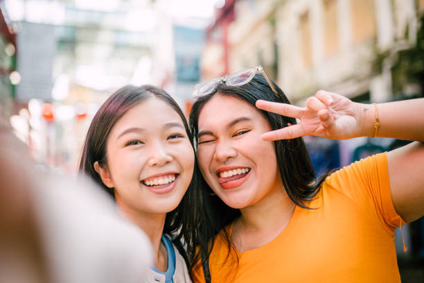 istock Happy Asian Best Friend Taking Selfie Together. 1854323335