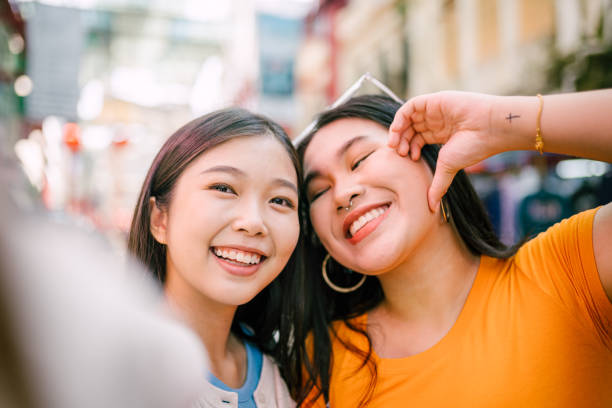 istock Happy Asian Best Friend Taking Selfie Together. 1854324934