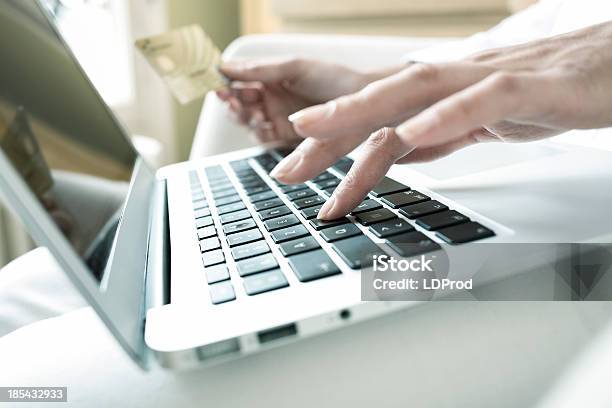 Woman Holding A Credit Card And Using Computer Online Shopping Stock Photo - Download Image Now