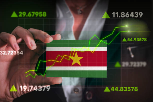 istock Graph growing up in Front Of Suriname Flag. 1854337010