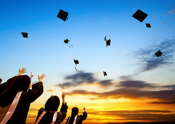 istock Graduate ceremony with students throwing away the hats 185434558