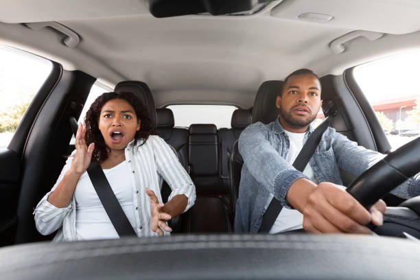 istock Shocked black couple in automobile looking at road 1854349724