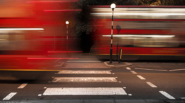 istock Red London bus motion blur at zebra crossing 185436256