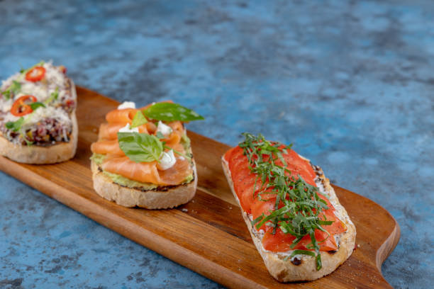 istock Assorted bruschetta on a wooden cutting board 1854371529