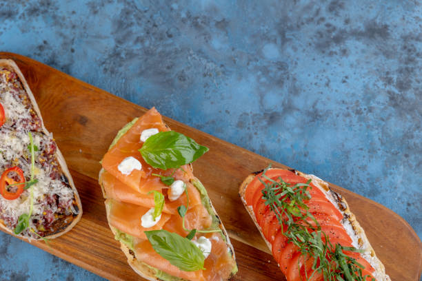 istock Assorted bruschetta on a wooden cutting board 1854371682