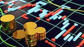 Economy Concept with a Stock Market Graphics and Coins