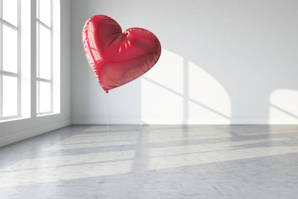 red heart balloon on white background