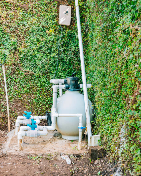 istock Pool purification and maintenance system. Home pool filter and treatment plant installed. Pool pump with sand filter installed 1854383038
