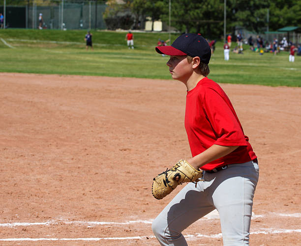 istock Youth Baseball Player Fielding w clipping mask 185438374