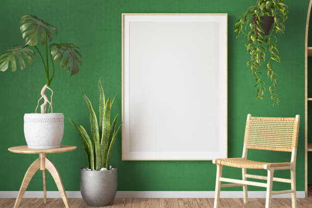 istock Empty Mockup Picture Frame on Green Wall with Indoor Plants and a Bamboo Chair 1854383938