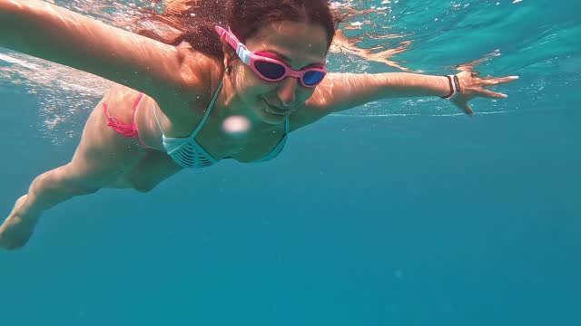 Young Woman Diving In The Red Sea In Egypt