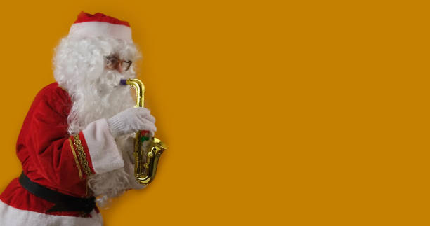 istock Santa Claus play on a saxophone. 1854397215