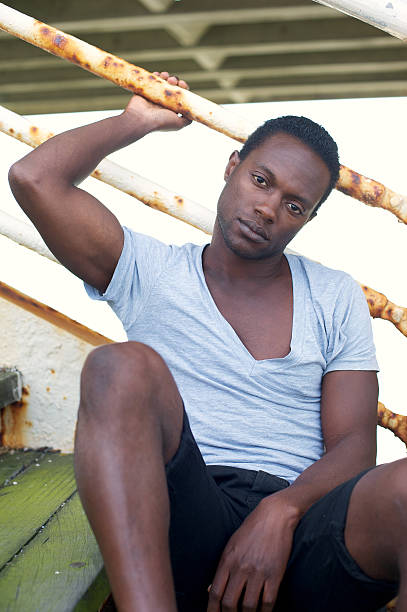 istock African american man sitting outdoors 185440083