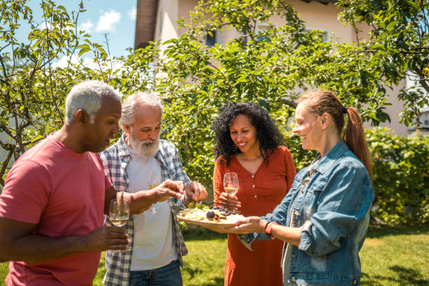 istock Cheerful Diverse Seniors Having Summer Picnic 1854401054