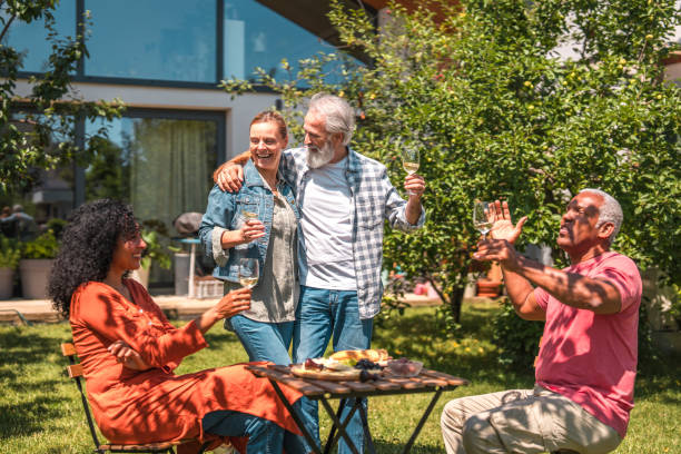 istock Sunny Backyard Get-Together With Joyful Senior Couples 1854401080