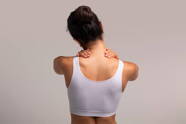 istock Unrecognizable young woman touching and self massaging her tired neck 1854408825