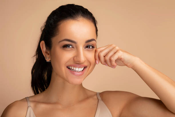 istock Smiling attractive millennial middle eastern woman touching her cheek 1854409392